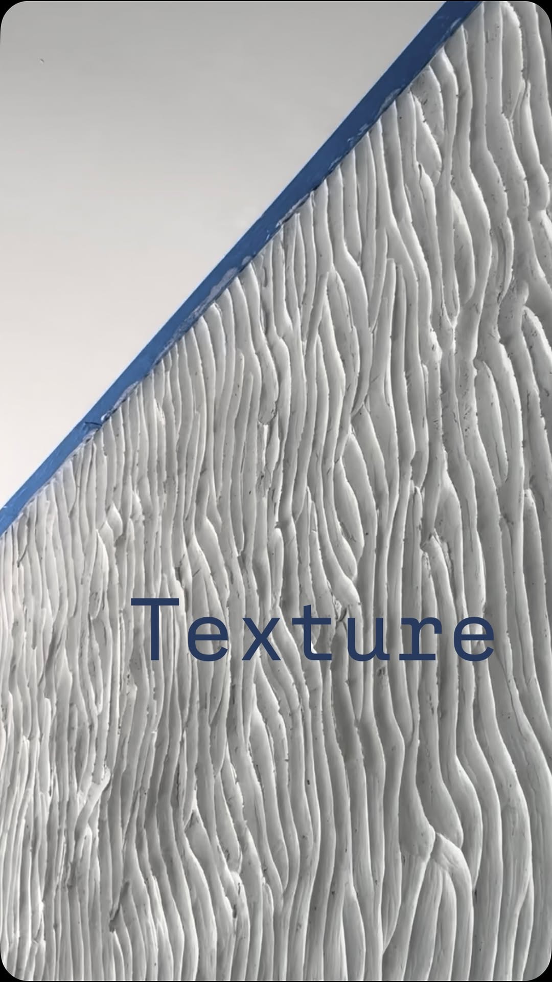 Hand-sculpted plaster texture in raking light